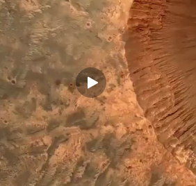 دهانه یا گودالی به عرض یک مایل بر سطح مریخ که با دوربین HiRISE توسط مدارگرد ناسا و از ارتفاع ۱۶۰ مایلی تصویربرداری شده است.